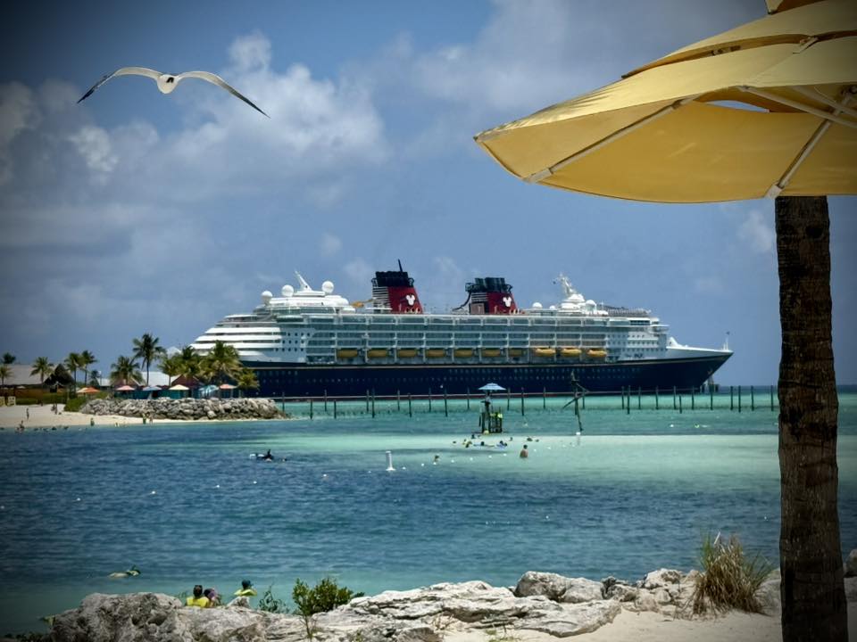 A view of our first Disney cruise ship on the water with sand in the front