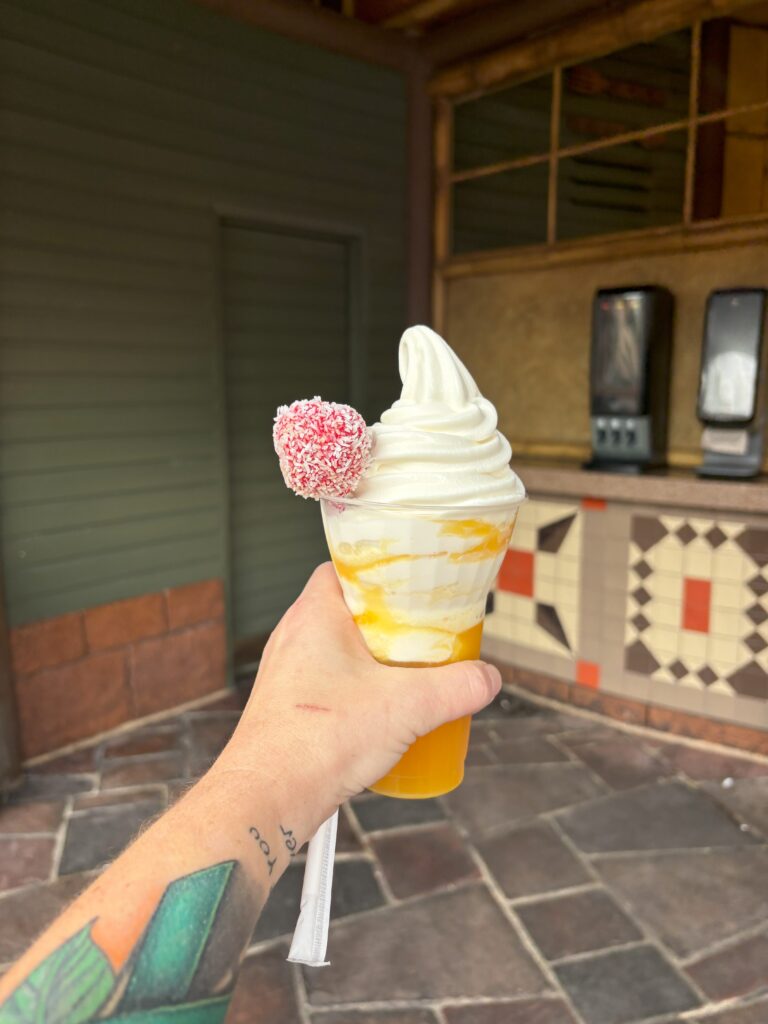 A pineapple dole whip drink near the Tiki Room in Magic Kingdom