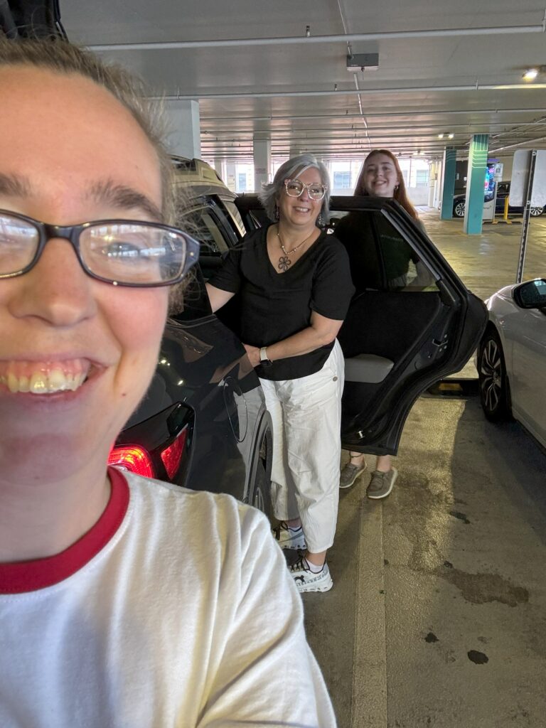 Three women in a Whole Foods Parking Lot