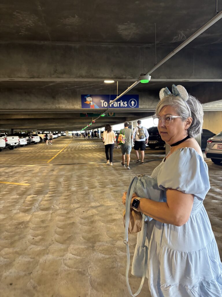 A lady in a disneyland parking lot
