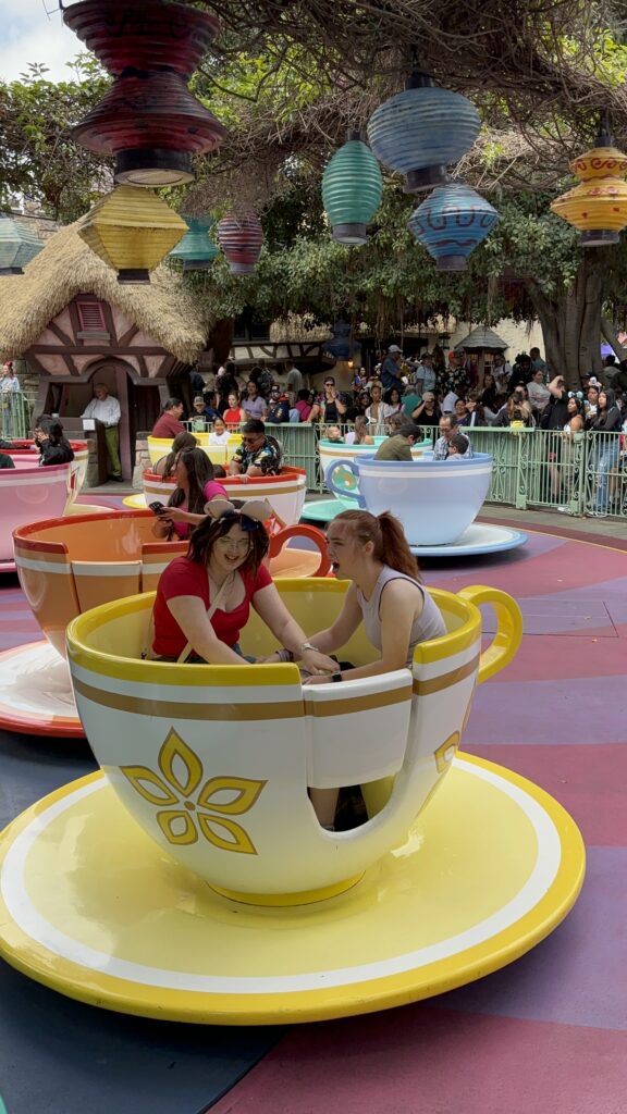 Two girls having fun in a tea cup at Mad Hatter's Tea Party