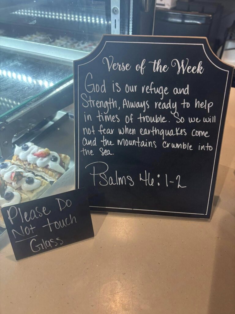 Verse of the week (Psalms 46:1-2) on a board