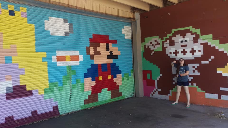 A mural of Mario and Princess Peach