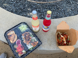 Our meal from Liberty Public Market- includes a tray of Asian food and BOPJO's korean tacos with two drinks in the middle