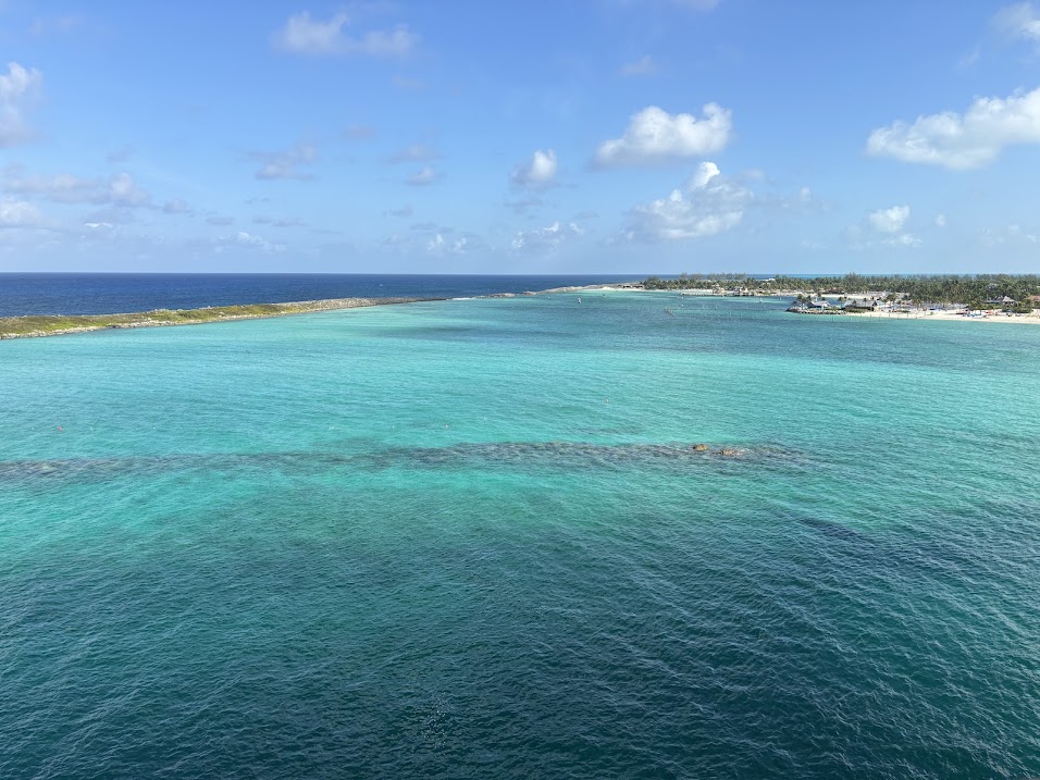 A blue ocean with an island off towards the right Castaway Cay Tips and Tricks